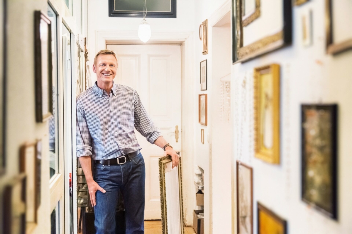 A man standing in a hallway.