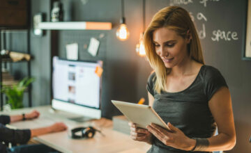 A woman uses Sortly's asset management system.