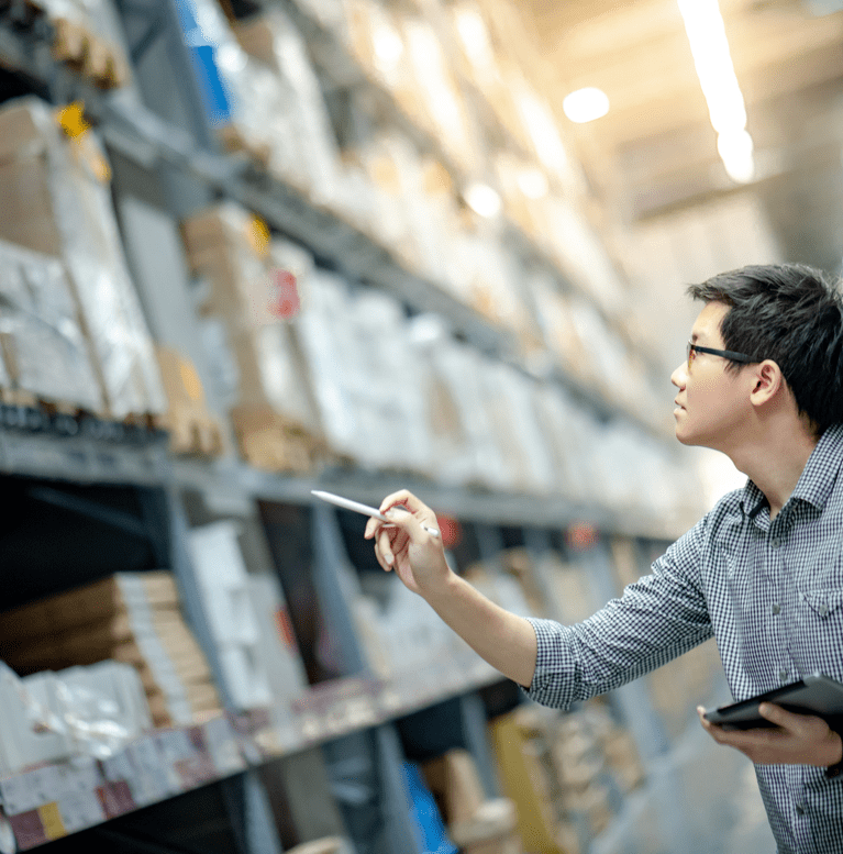 A man takes inventory at a small business