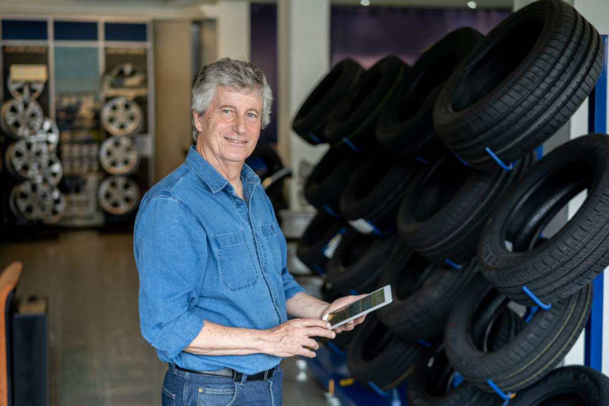 A business owner takes inventory of his automotive parts.