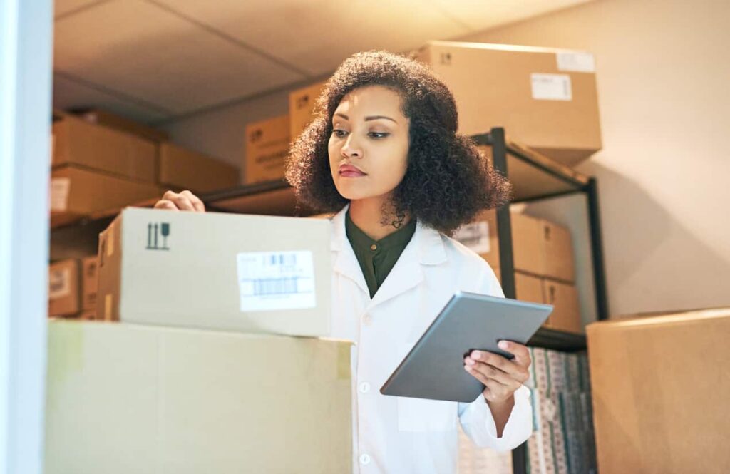 Hospital worker calculating inventory