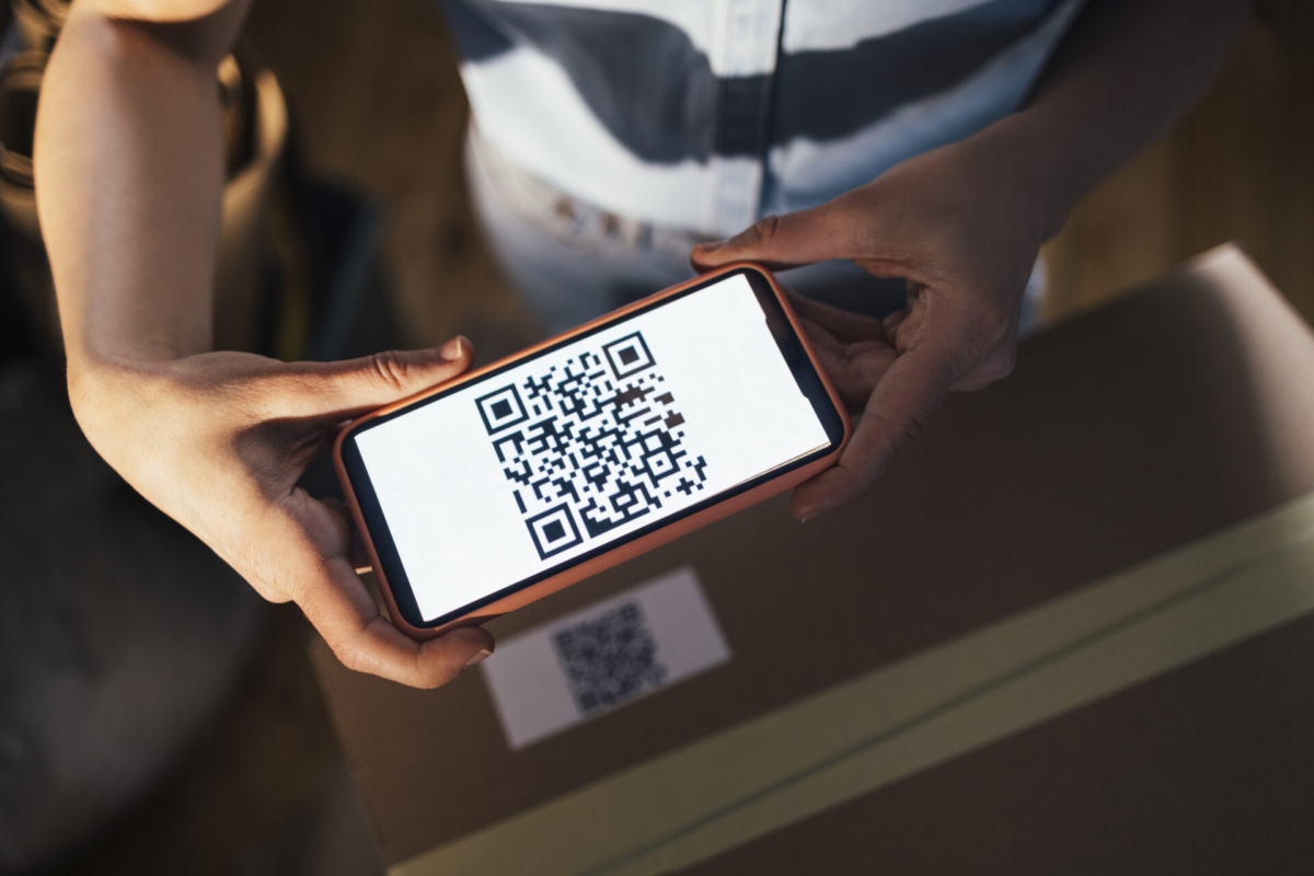 Person scanning QR code for inventory.