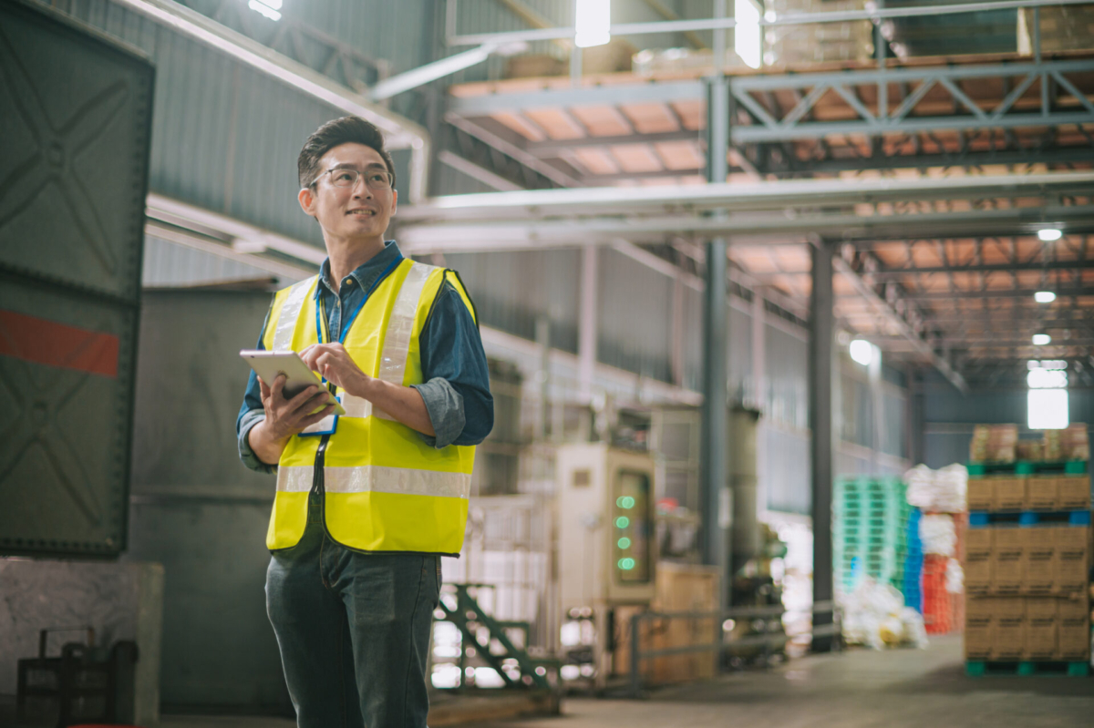 Employee using AI for inventory management on a tablet