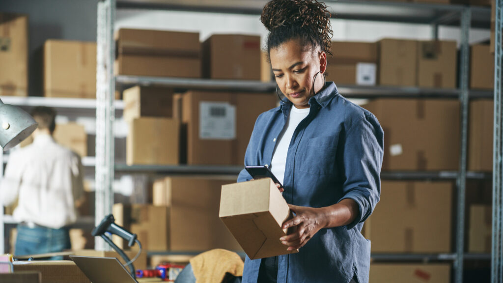 Woman scanning barcode with smartphone