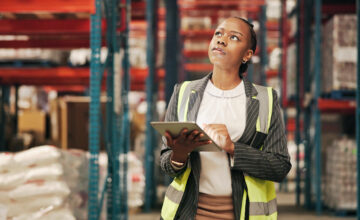A woman checks safety stock levels.