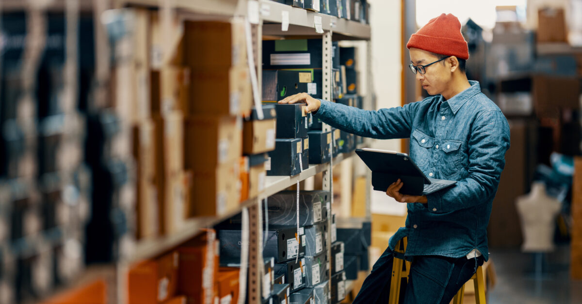 An employee uses automated inventory management.