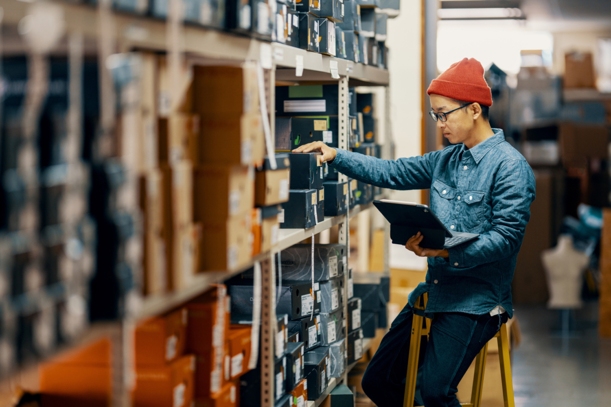An employee uses automated inventory management.