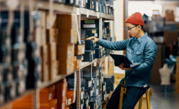 An employee uses automated inventory management.