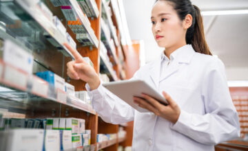 A woman practices healthcare inventory management.