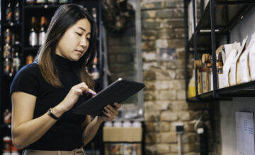 An employee manages an inventory database.