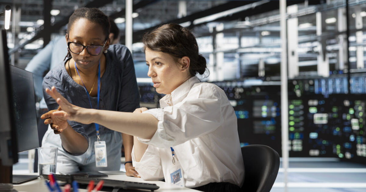 Two employees perform hardware asset management.