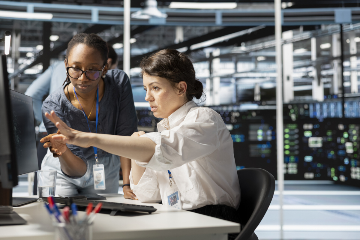 Two employees perform hardware asset management.