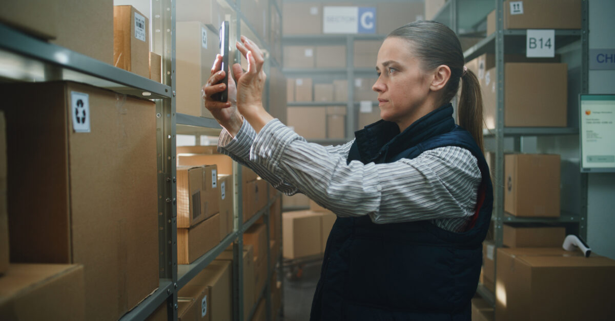 An employee uses an asset check in check out system.