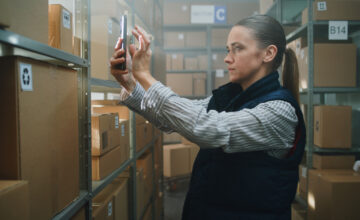 An employee uses an asset check in check out system.