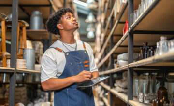 A man uses a tablet for remote asset management.