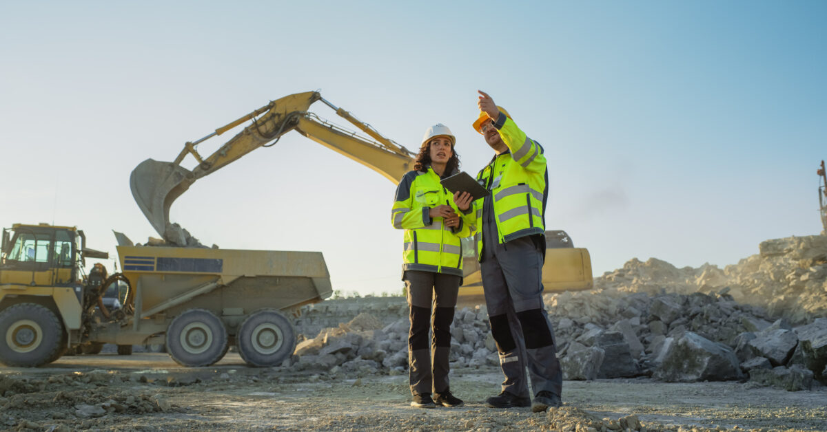 Two construction employees on remote job site