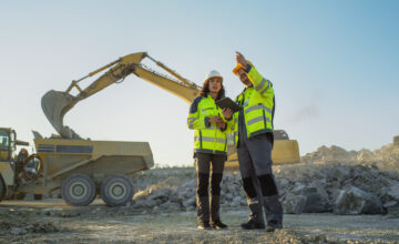 Two construction employees on remote job site