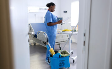 MRO inventory management software is used by a janitorial staff member.
