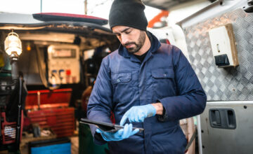 field technician using AI on tablet