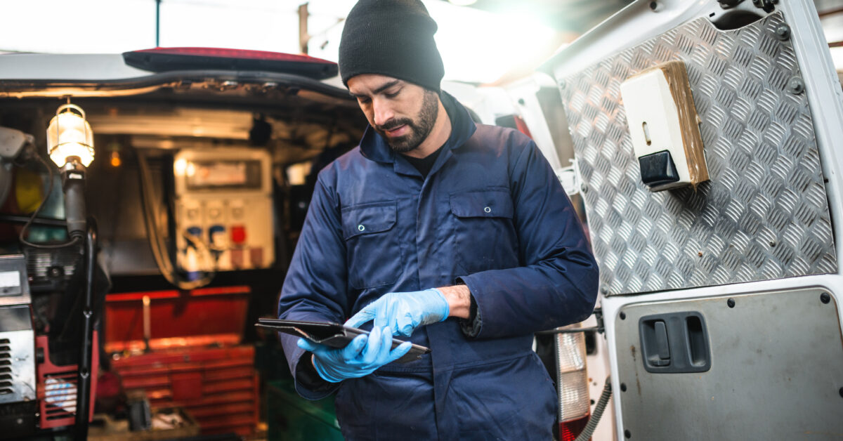 A tech uses field service inventory management software