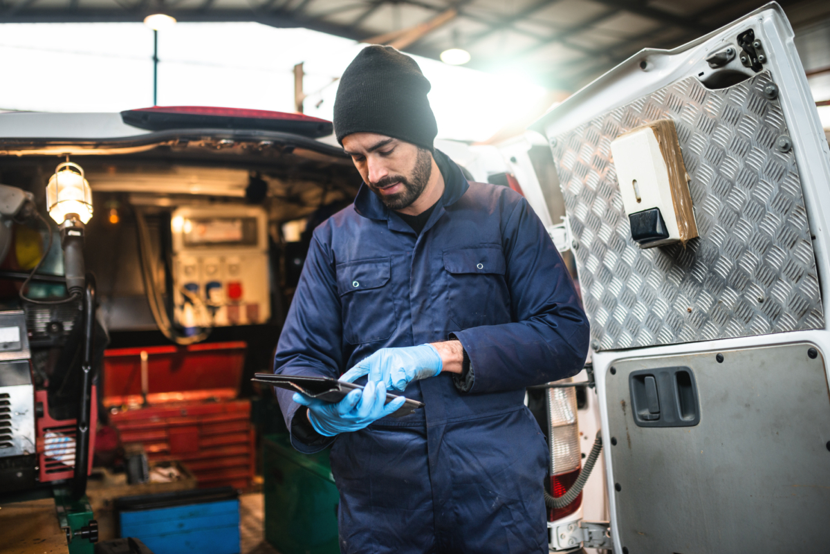 A tech uses field service inventory management software
