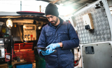 A tech uses field service inventory management software