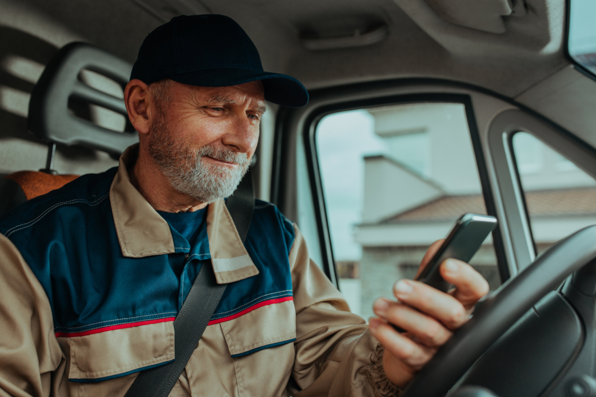 A technician practices service truck inventory management on his phone.
