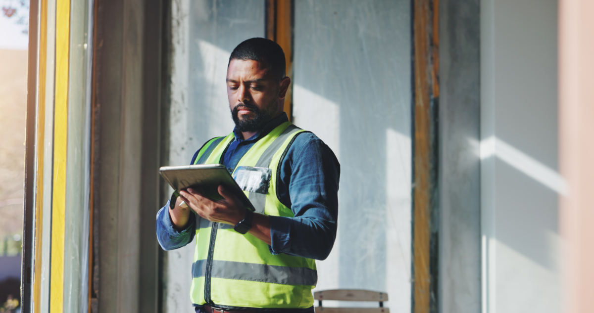 An employee practices construction supply chain management using software.
