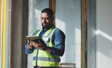 An employee practices construction supply chain management using software.